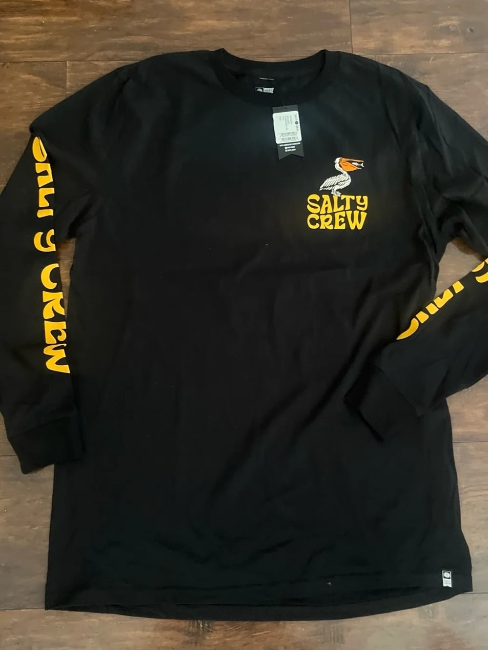 Salty Crew Black Long Sleeve Swim Tee with Yellow & Blue Pelican Graphic